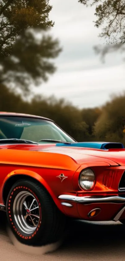 Classic red muscle car on scenic road in autumn.