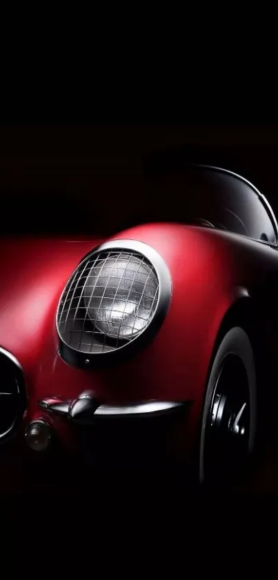 Classic red sports car on dark background wallpaper.