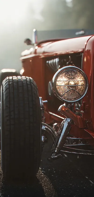 Close-up of a classic red vintage car on a road.