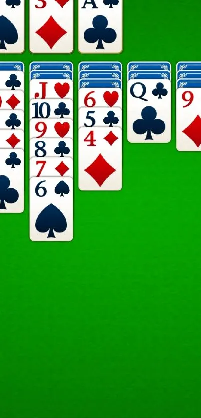 Classic solitaire layout on a green background with card suits.