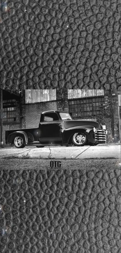 Vintage black truck on textured background wallpaper.