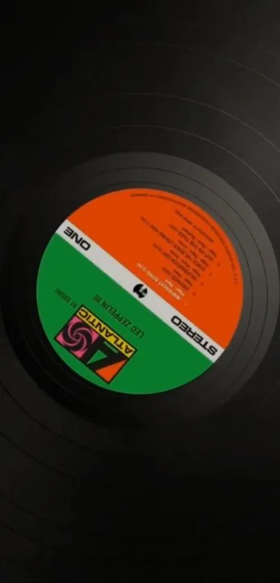 Upside-down vinyl record with colorful label design.