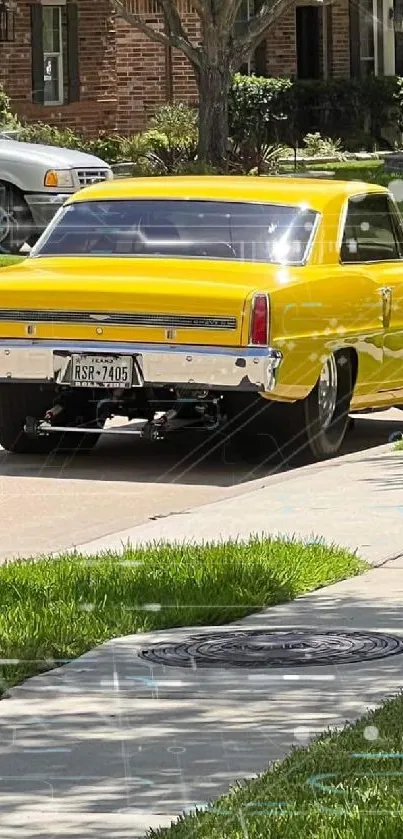 Yellow classic car on a suburban street, parked and gleaming.