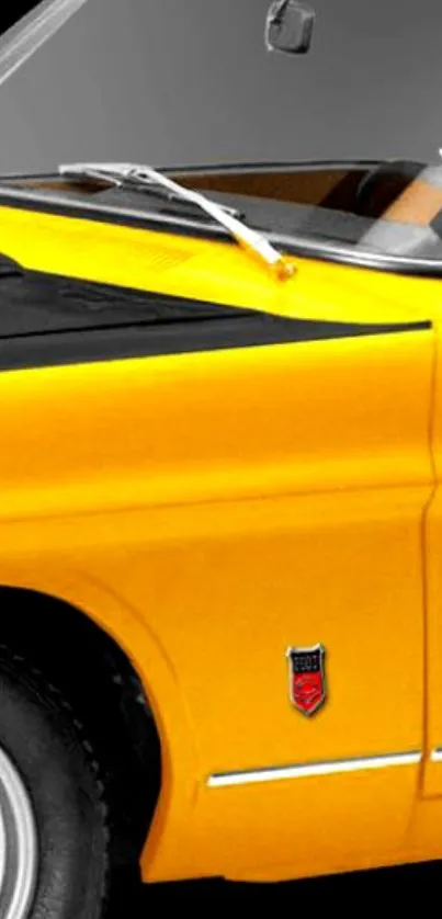 Mobile wallpaper featuring a classic yellow vintage car with sleek design.