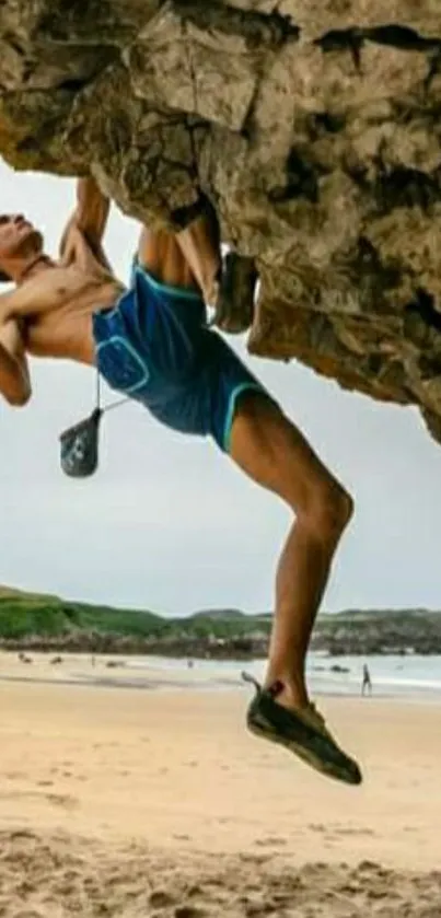 Man climbing rocky overhang on beach.