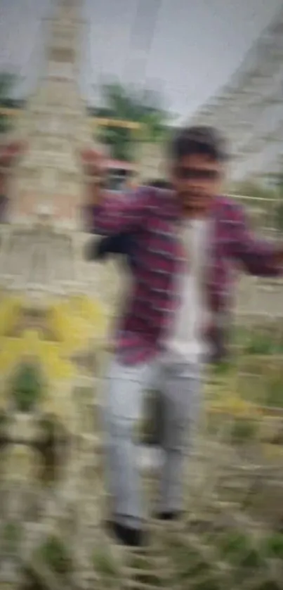 Blurred image of a person climbing a rope net outdoors.