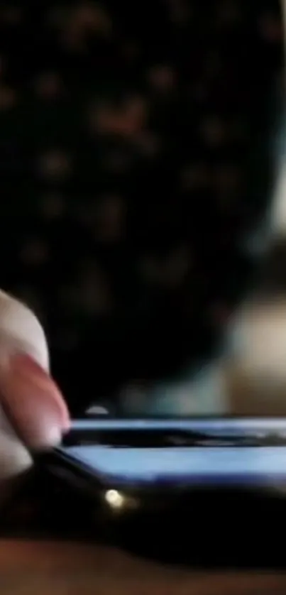 Close-up of hand interacting with smartphone screen.