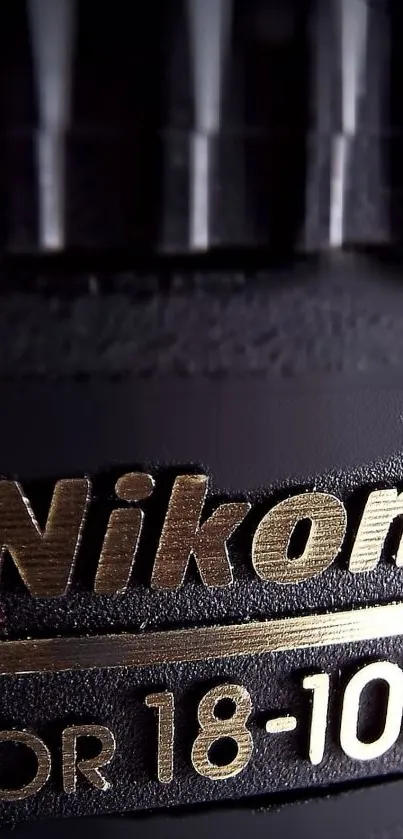 Close-up of NIKKOR lens with Nikon branding and detailed texture.