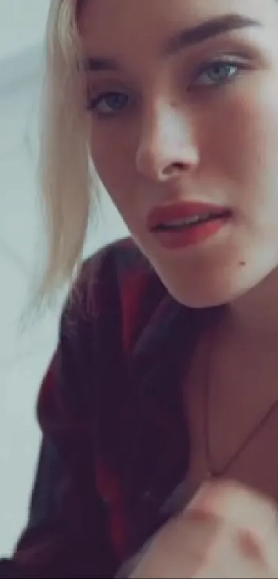 Close-up of a woman with soft lighting and serene expression.