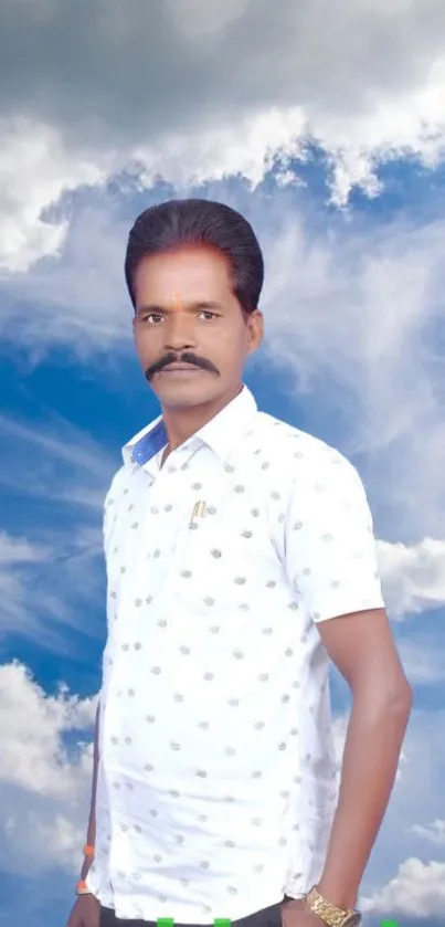 Portrait of a person against a cloudy blue sky background.