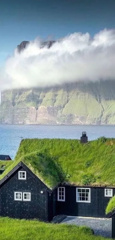 Coastal cabin with grassy rooftops and sea view.