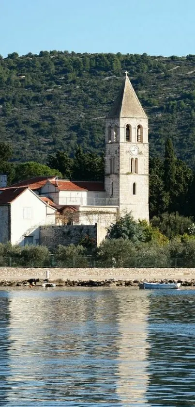 Scenic wallpaper with a coastal church reflecting on calm water.