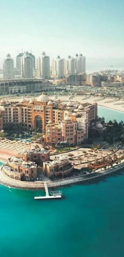 Aerial view of coastal cityscape with turquoise waters and modern buildings.