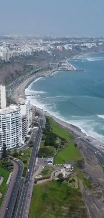 Aerial view of a coastal city with ocean waves and urban skyline.