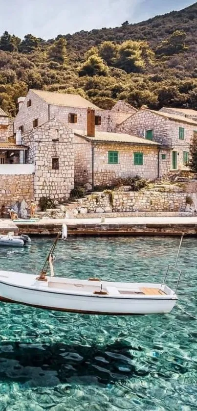 Turquoise coastal village with boat and stone houses.