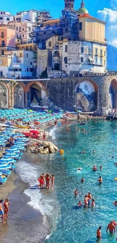 Vibrant coastal town with beachgoers on a sunny day, perfect for mobile wallpaper.