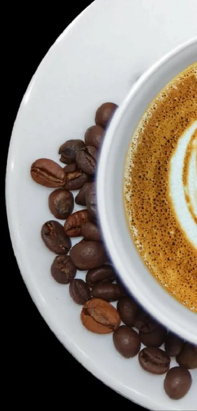 Coffee cup with latte art and beans on a plate.