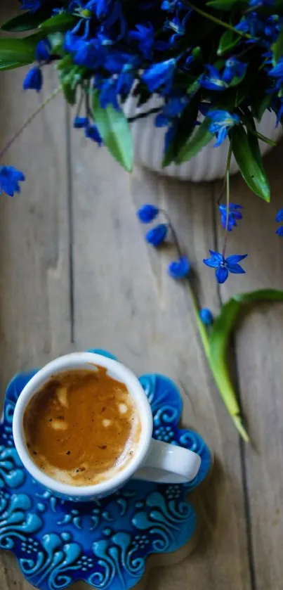 Blue flower arrangement with coffee on wooden table