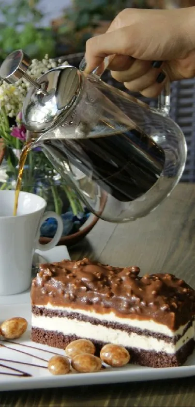 Cup of coffee and a slice of cake on a wooden table.