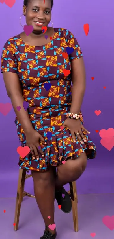 Woman in colorful African dress on a purple background.