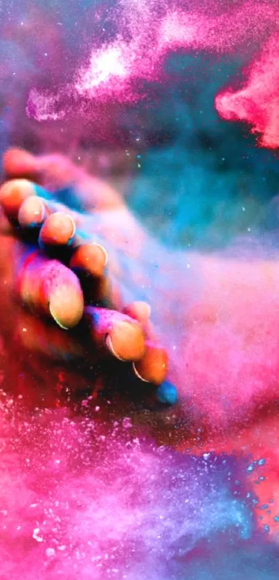 Vivid abstract hand with splashes of pink, blue, and red colors.