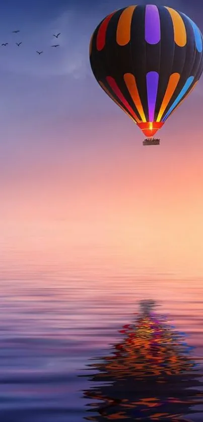 Colorful hot air balloon at sunset over reflective waters.