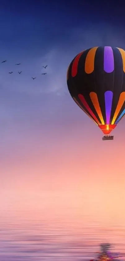 Colorful hot air balloon in serene sky over water.