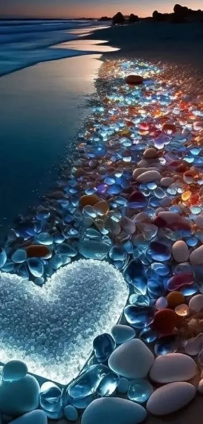 Glowing heart on a colorful pebble beach at night.