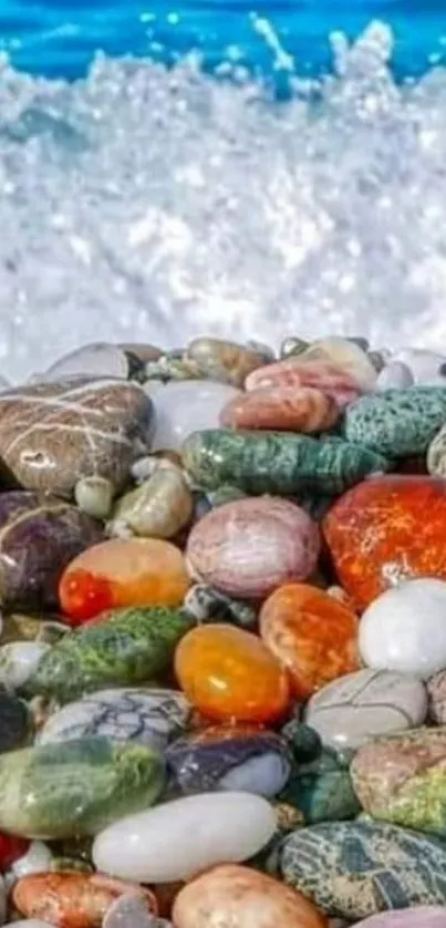 Colorful pebbles with ocean waves in a beach setting.