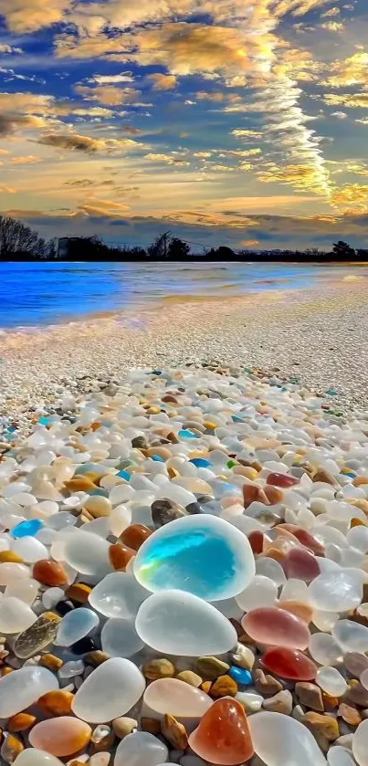 Vibrant beach pebbles under a scenic ocean sunset.