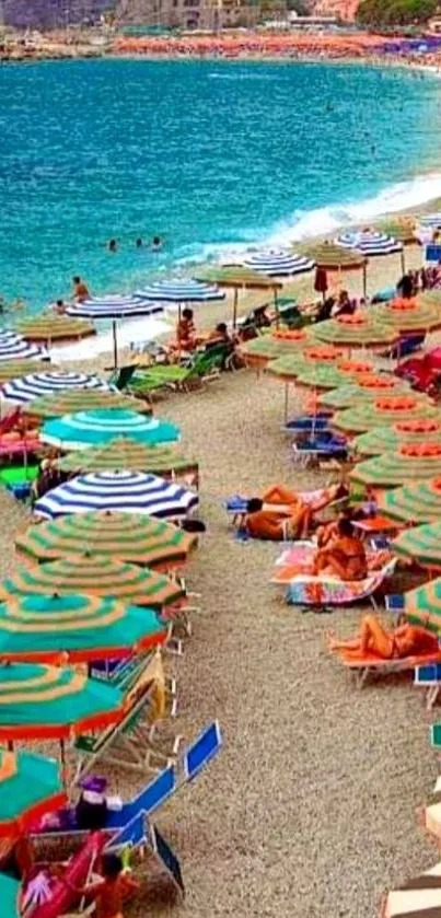 Colorful beach umbrellas on a sandy shore with turquoise water.