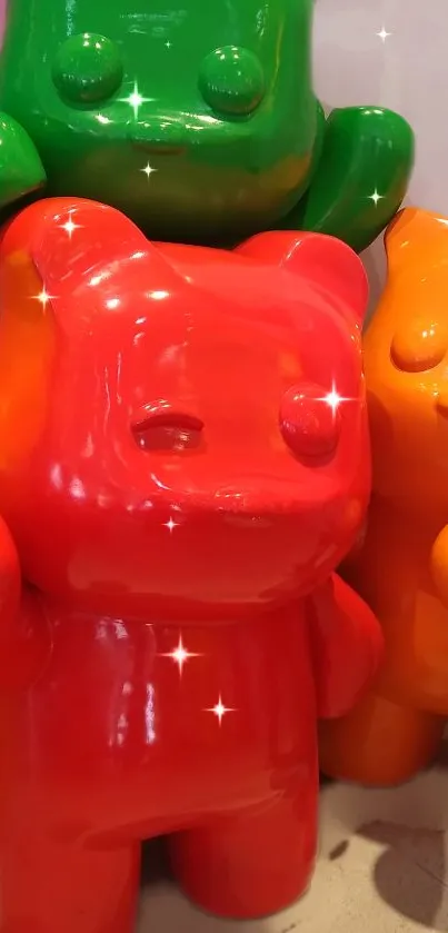 Colorful glossy bear figurines in red, orange, and green with sparkles.