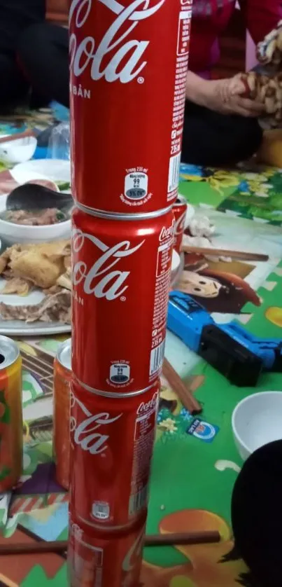 Stack of colorful beverage cans on a playful and vibrant mat.