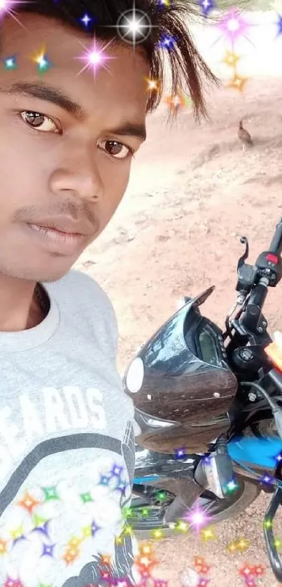 Young man posing with a motorcycle amidst colorful sparkles.