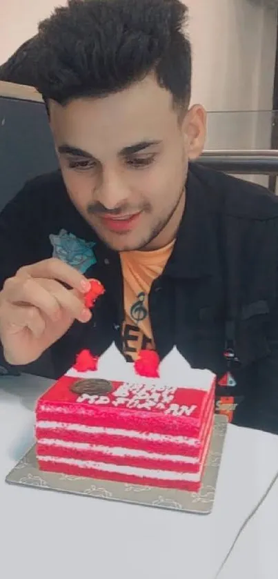 Person with festive birthday cake in a bright festive setting.