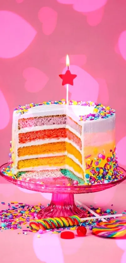 Colorful rainbow cake with sprinkles on pink background.