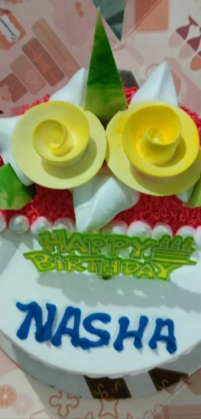 Vibrant birthday cake with floral decorations.