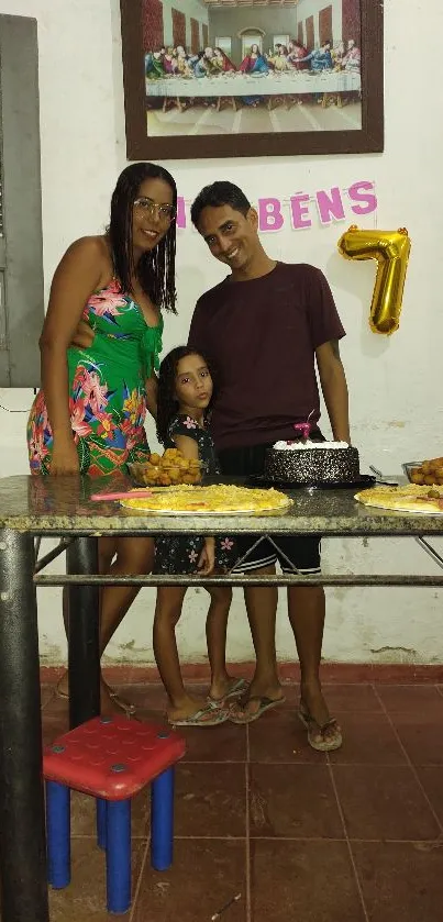 Family celebrating a birthday with colorful decorations and cake.