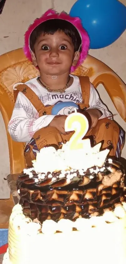 Cheerful child celebrating birthday with cake and colorful balloons.