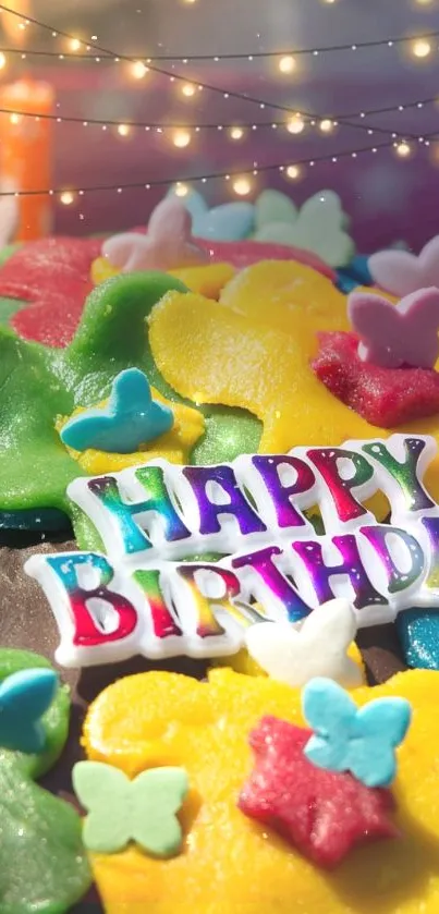 Colorful birthday treats and decorations with Happy Birthday sign.