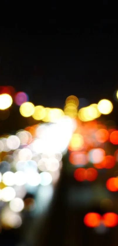 Colorful bokeh city lights at night, creating an abstract and vibrant display.