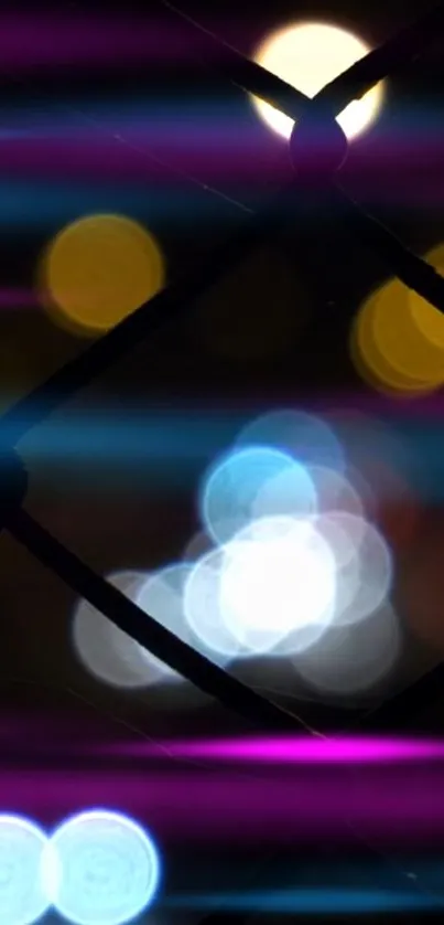 Colorful bokeh lights with purple and blue hues on a black background.