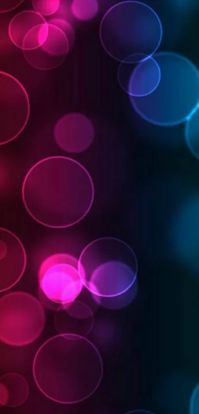 Vibrant colorful bokeh wallpaper with glowing circles in pink and blue hues.