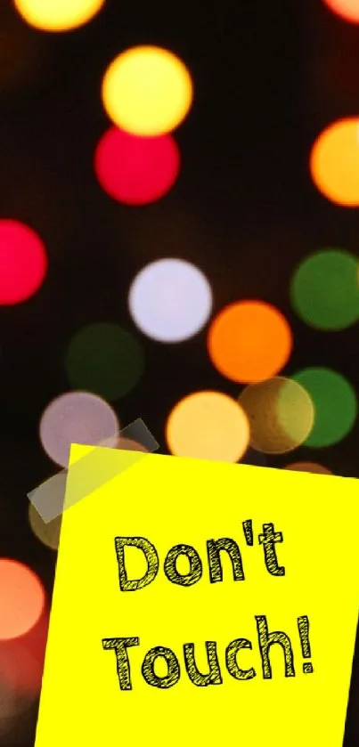 Colorful bokeh wallpaper with a yellow sticky note saying 'Don't Touch!'