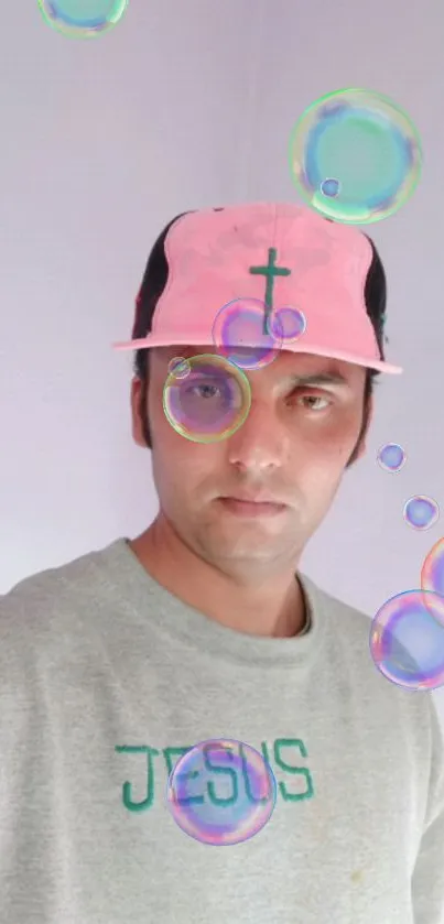 Man wearing cross cap, surrounded by colorful bubbles.