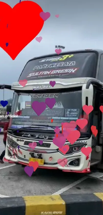 Double decker bus with a red heart graphic on top as mobile wallpaper.