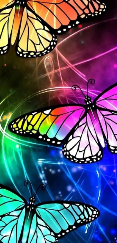 Three vibrant butterflies in neon colors on a dark background.