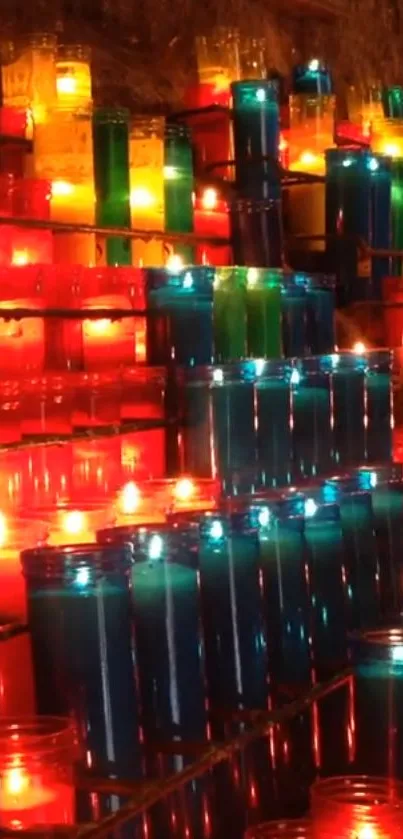 A vibrant display of colorful candles glowing softly.