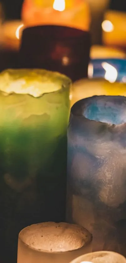 Vibrant, colorful candles glowing warmly in the darkness.