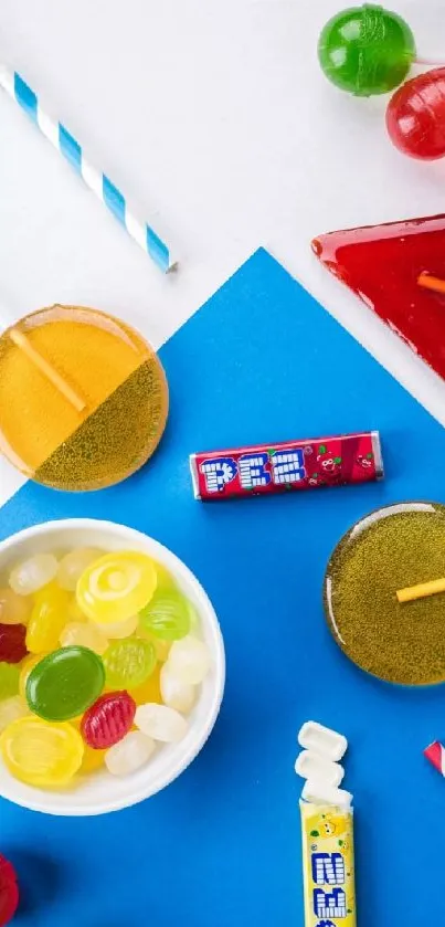 Colorful candies and lollipops on a blue and white background.